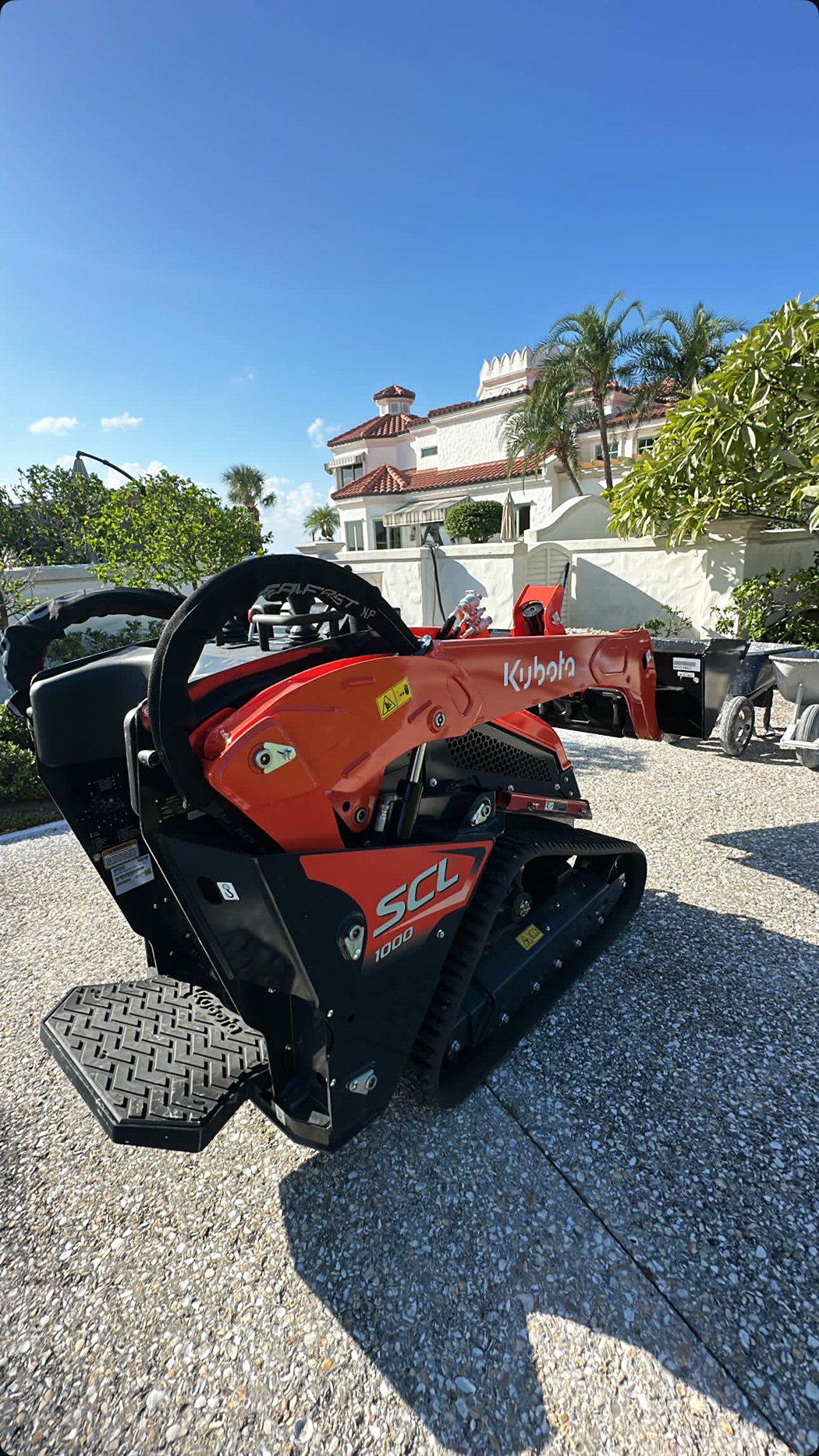 CAB Glover Enterprises Kubota SCL 1000 skid steer on a Melbourne FL job site